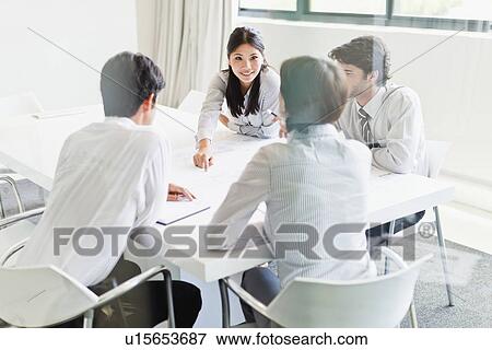 Business people talking in meeting View Large Photo Image Stock Photo - Business people talking in meeting. Fotosearch