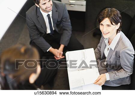 Picture - Business people talking in office. Fotosearch