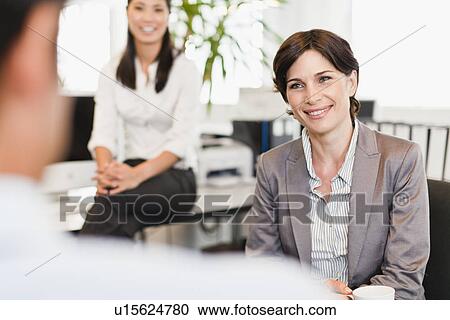 Business people talking in office View Large Photo Image Stock Image - Business people talking in office. Fotosearch