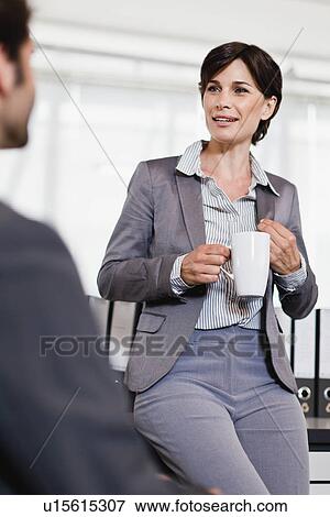 Business people talking in office View Large Photo Image Stock Photo - Business people talking in office. Fotosearch