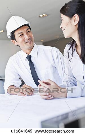 Business people talking in office View Large Photo Image Stock Photo - Business people talking in office. Fotosearch