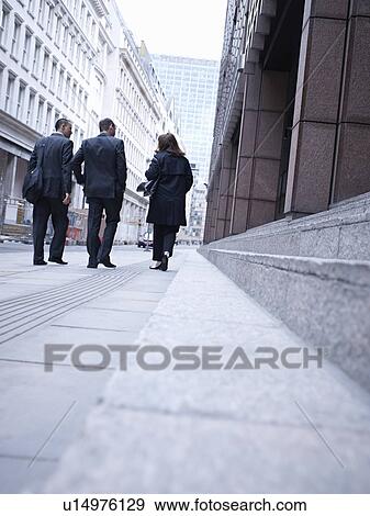 Stock Photo - Business people walking on city street. Fotosearch
