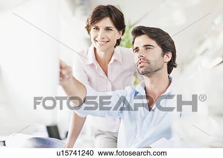 Business people working on computer View Large Photo Image Stock Image - Business people working on computer. Fotosearch