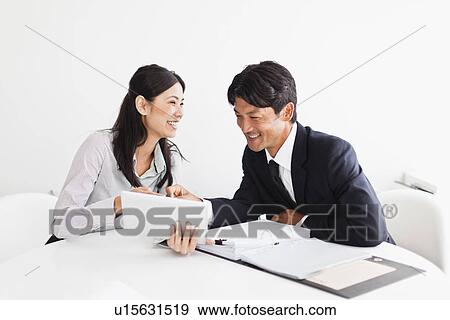 Business people working together View Large Photo Image Stock Photo - Business people working together. Fotosearch