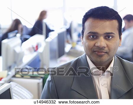 Businessman sitting in office View Large Photo Image Stock Image - Businessman sitting in office. Fotosearch