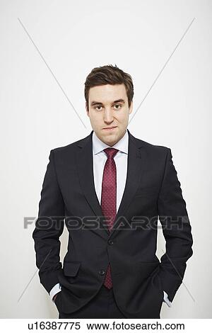 Businessman standing with hands in pockets View Large Photo Image Stock Photography - Businessman standing with hands in pockets. Fotosearch