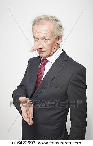 Businessman with long nose offering hand View Large Photo Image Stock Image - Businessman with long nose offering hand. Fotosearch