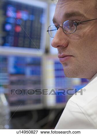 Businessman working at computer View Large Photo Image Stock Photo - Businessman working at computer. Fotosearch