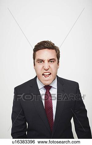Businessman yelling indoors View Large Photo Image Stock Photograph - Businessman yelling indoors. Fotosearch