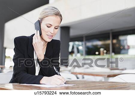 Businesswoman talking on cell phone View Large Photo Image Picture - Businesswoman talking on cell phone. Fotosearch