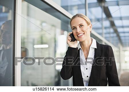 Businesswoman talking on cell phone View Large Photo Image Picture - Businesswoman talking on cell phone. Fotosearch