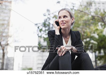 Businesswoman talking on cell phone View Large Photo Image Stock Image - Businesswoman talking on cell phone. Fotosearch