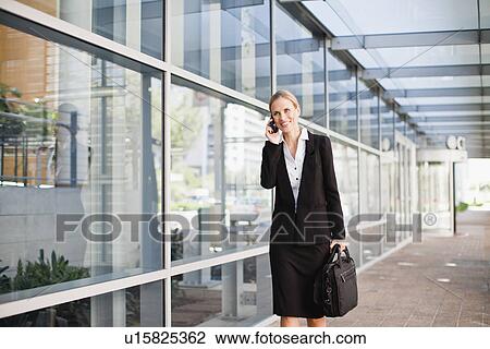 Businesswoman talking on cell phone View Large Photo Image Stock Image - Businesswoman talking on cell phone. Fotosearch