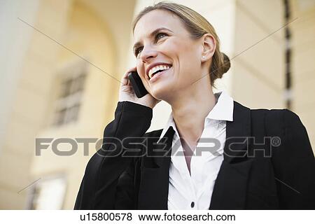 Businesswoman talking on cell phone View Large Photo Image Stock Photo - Businesswoman talking on cell phone. Fotosearch
