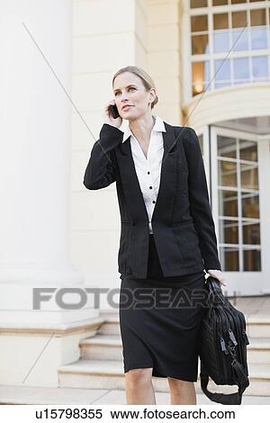 Businesswoman talking on cell phone View Large Photo Image Stock Photography - Businesswoman talking on cell phone. Fotosearch