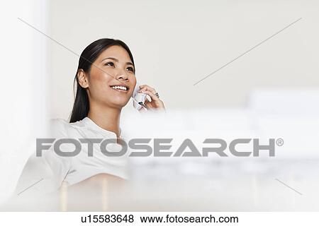Businesswoman talking on telephone View Large Photo Image Stock Photo - Businesswoman talking on telephone. Fotosearch