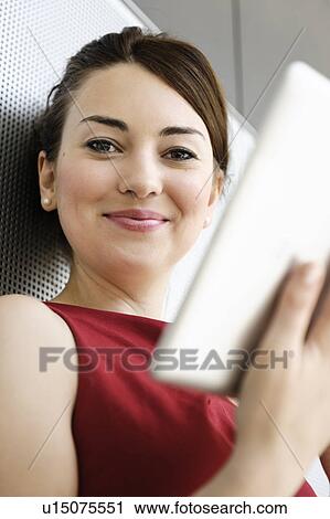 Businesswoman using tablet computer View Large Photo Image Stock Image - Businesswoman using tablet computer. Fotosearch