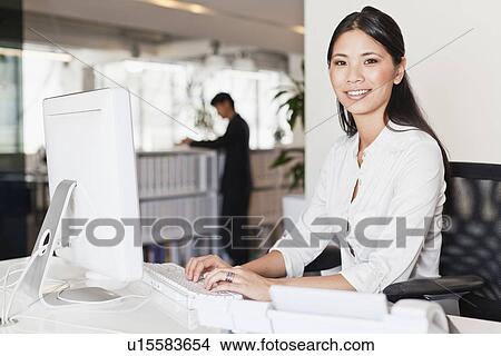 Businesswoman working on computer View Large Photo Image Picture - Businesswoman working on computer. Fotosearch