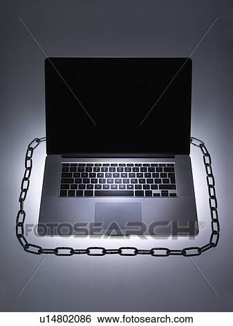 Stock Photograph - Chain around laptop computer. Fotosearch
