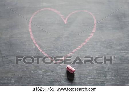 Stock Photography - Chalk and heart shape on blackboard. Fotosearch