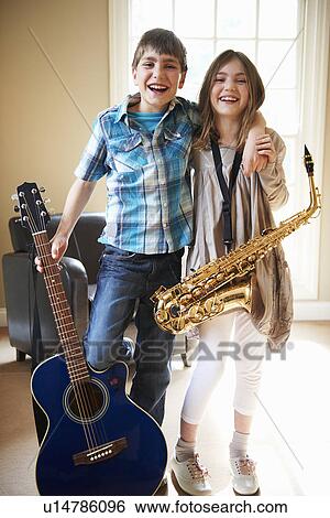 Stock Photograph - Children holding musical instruments. Fotosearch
