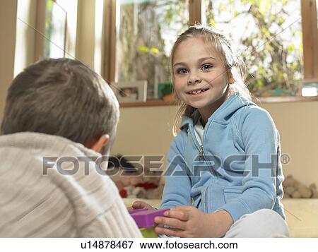 Stock Photo - Children playing together indoors. Fotosearch