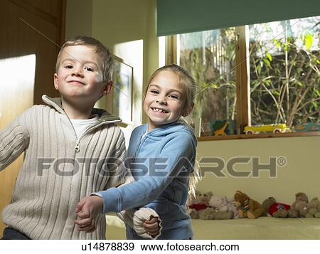 Children playing together indoors View Large Photo Image Stock Photo - Children playing together indoors. Fotosearch