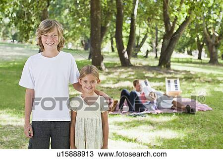 Children smiling in park View Large Photo Image Stock Image - Children smiling in park. Fotosearch