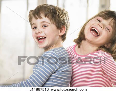 Children smiling together indoors View Large Photo Image Stock Image - Children smiling together indoors. Fotosearch
