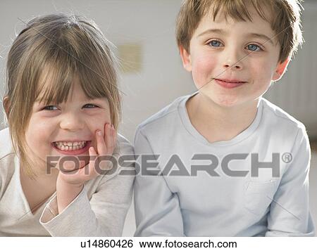 Children smiling together indoors View Large Photo Image Stock Photograph - Children smiling together indoors. Fotosearch