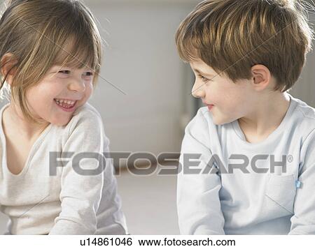 Children smiling together indoors View Large Photo Image Stock Photograph - Children smiling together indoors. Fotosearch