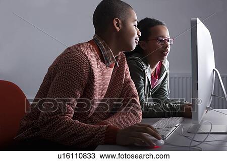 Children using computer together View Large Photo Image Stock Image - Children using computer together. Fotosearch