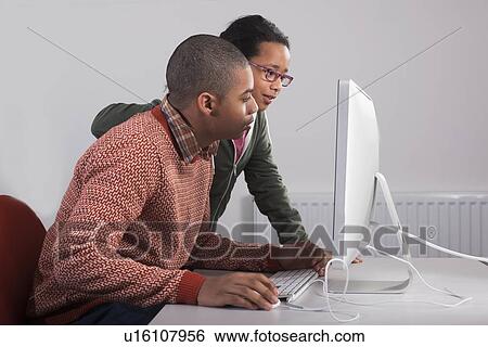 Children using computer together View Large Photo Image Stock Photograph - Children using computer together. Fotosearch