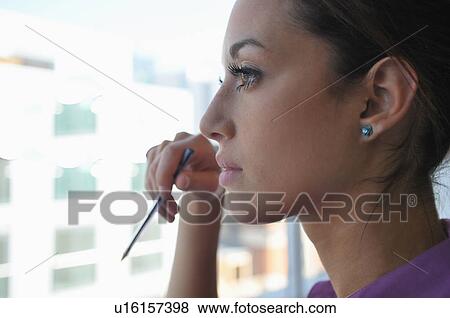 Close up of businesswomans face View Large Photo Image Stock Photo - Close up of businesswomans face. Fotosearch