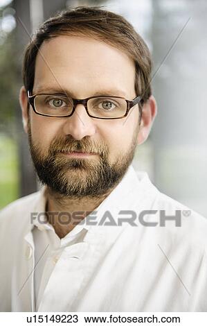 Stock Image - Close up of doctors serious face. Fotosearch
