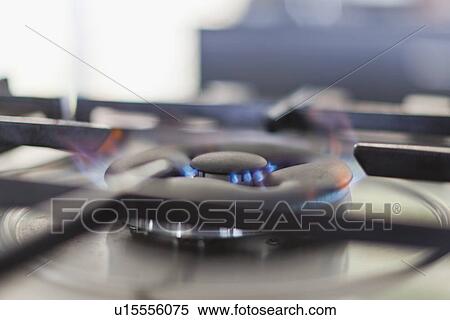 Stock Photography - Close up of gas burner with flame. Fotosearch