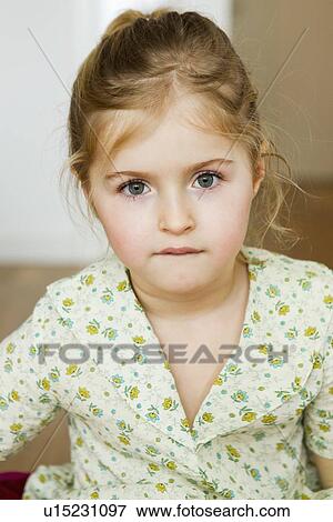Stock Photo - Close up of girls serious face. Fotosearch