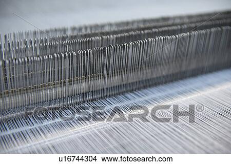 Picture - Close up of loom in textile mill. Fotosearch