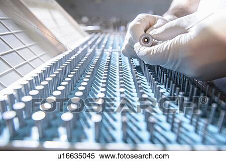 Stock Photography - Close up of measuring rods in factory. Fotosearch