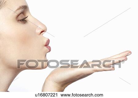Close up of woman blowing a kiss View Large Photo Image Stock Image - Close up of woman blowing a kiss. Fotosearch