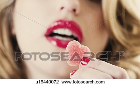Close up of woman holding gummy candy View Large Photo Image Stock Image - Close up of woman holding gummy candy. Fotosearch