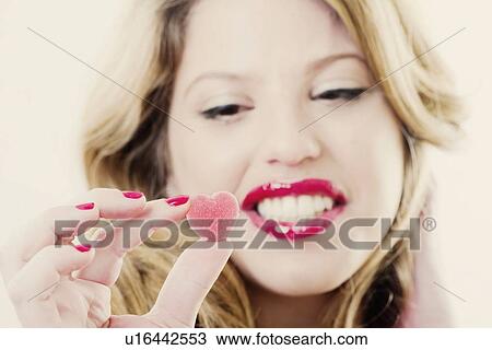 Close up of woman holding gummy candy View Large Photo Image Stock Image - Close up of woman holding gummy candy. Fotosearch