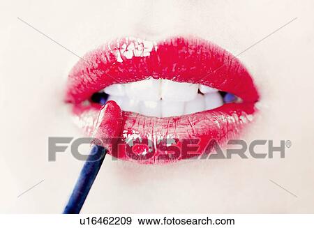 Close up of womans lips with lip gloss View Large Photo Image Stock Photo - Close up of womans lips with lip gloss. Fotosearch