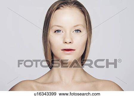 Stock Photo - Close up of womans serious face. Fotosearch