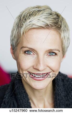 Stock Image - Close up of womans smiling face. Fotosearch