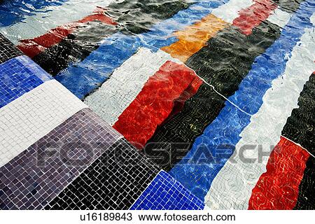 Stock Image - Colorful tiles in swimming pool. Fotosearch