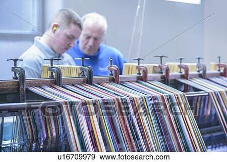 Colorful yarn on loom in textile mill View Large Photo Image Stock Photo - Colorful yarn on loom in textile mill. Fotosearch