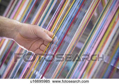 Colorful yarn on loom in textile mill View Large Photo Image Stock Photography - Colorful yarn on loom in textile mill. Fotosearch