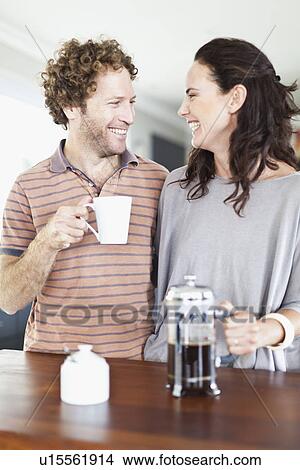 Picture - Couple drinking coffee together. Fotosearch