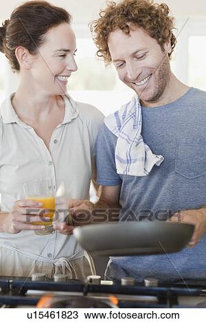 Stock Image - Couple talking at breakfast. Fotosearch